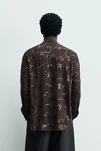 CHEMISE SEMI-TRANSPARENTE À PAILLETTES LIMITED EDITION