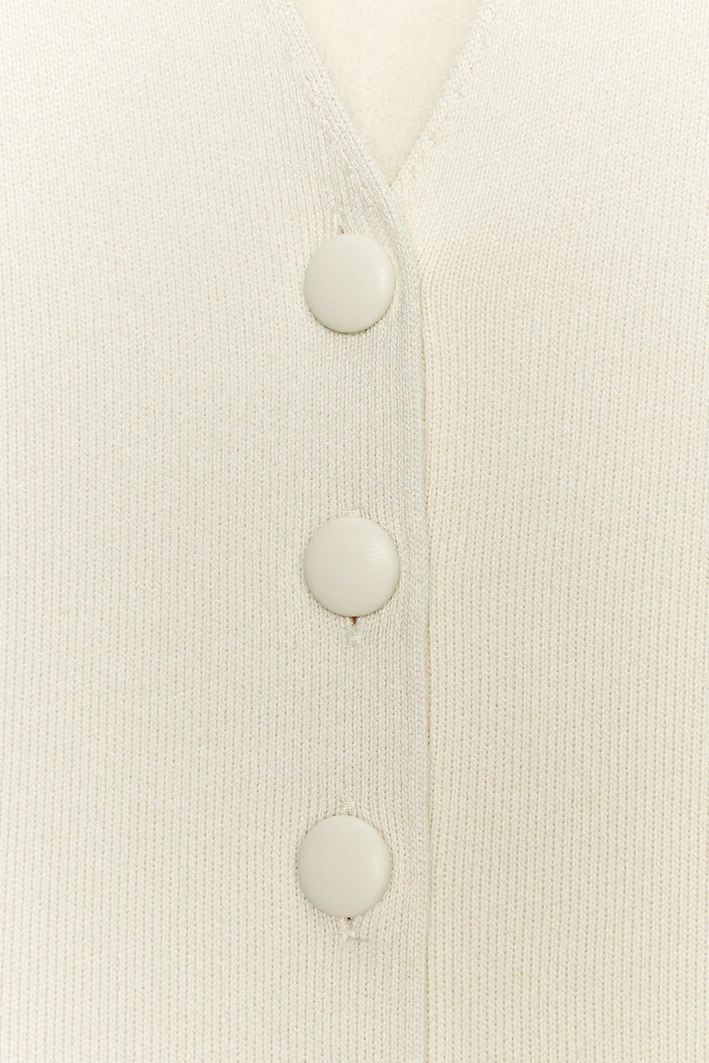 COVERED BUTTON KNIT VEST