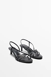 Leather heeled sandals with buckles