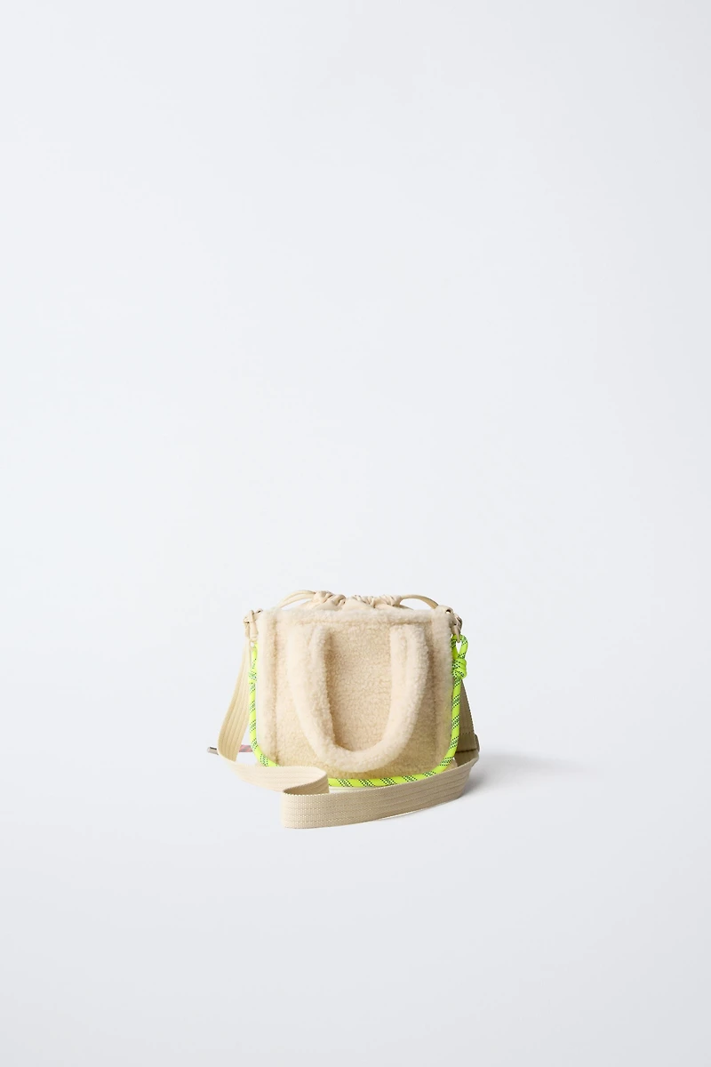 SAC BANDOULIÈRE EN PEAU DE MOUTON CHARM