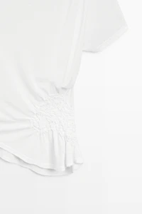 Asymmetric top with embroidered detail