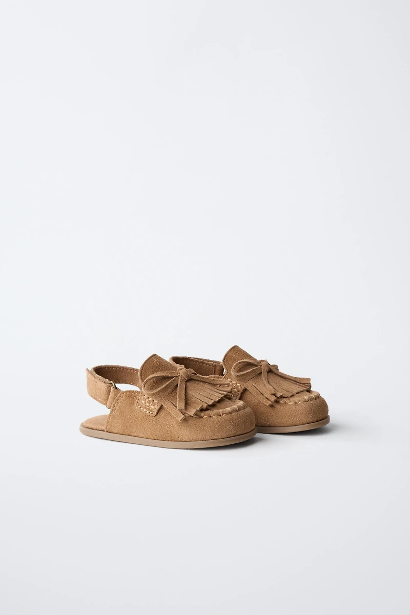 SABOTS EN CUIR PIEDS NUS