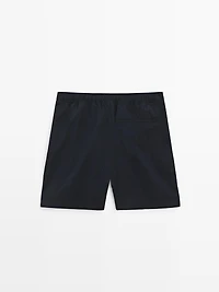 Plain swimming trunks with waist detail