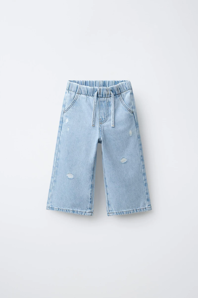 WIDE LEG RIPPED JEANS