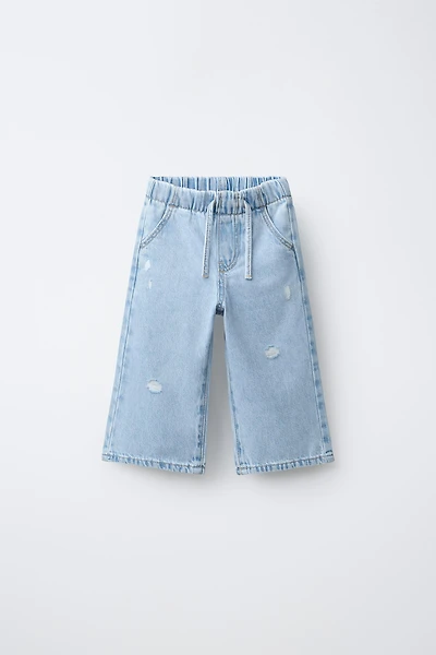 JEAN WIDE LEG À DÉCHIRURES