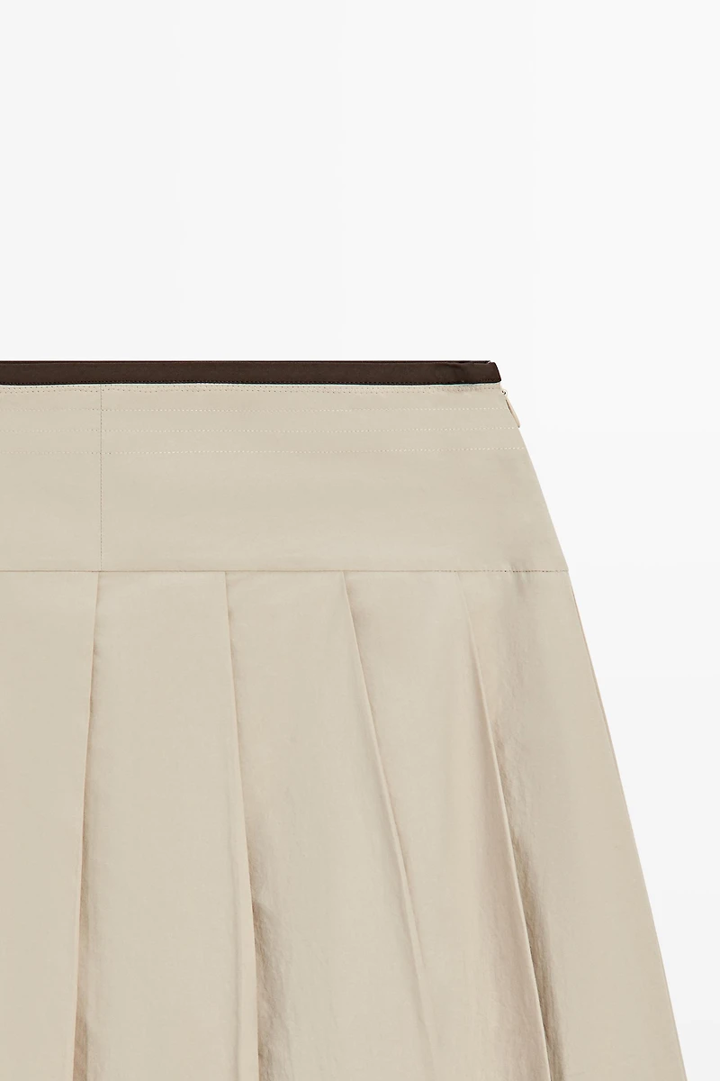 Pleated midi skirt with contrasting sash