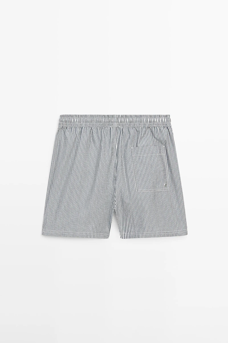 Swimming trunks with striped details