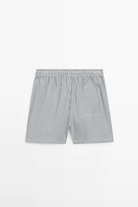Swimming trunks with striped details