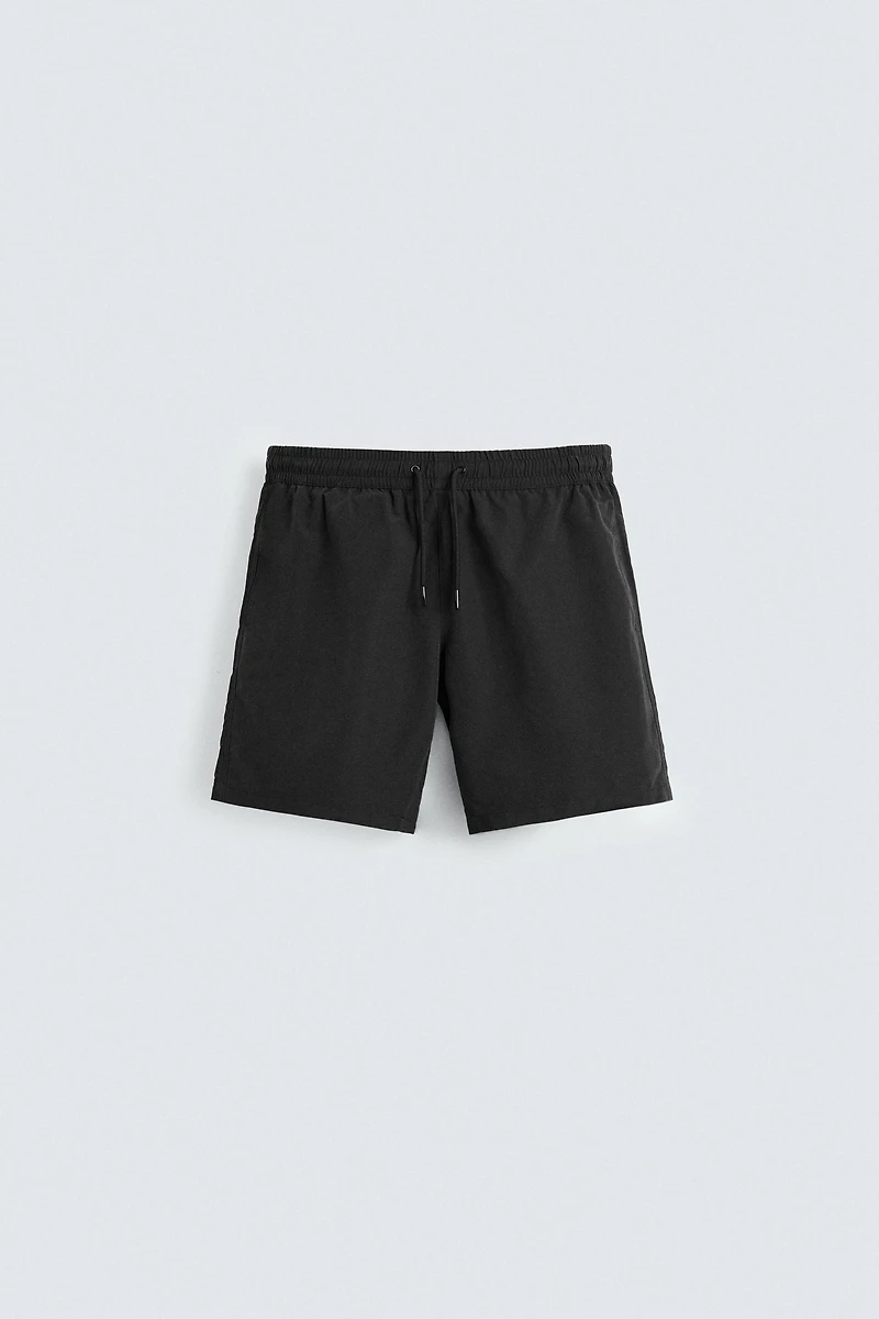 BASIC LONG SWIM TRUNKS