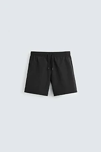 BASIC LONG SWIM TRUNKS