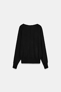 PULL EN MAILLE À COL V