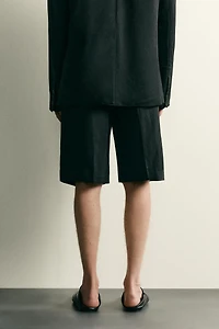 TEXTURED PLEATED SUIT SHORTS