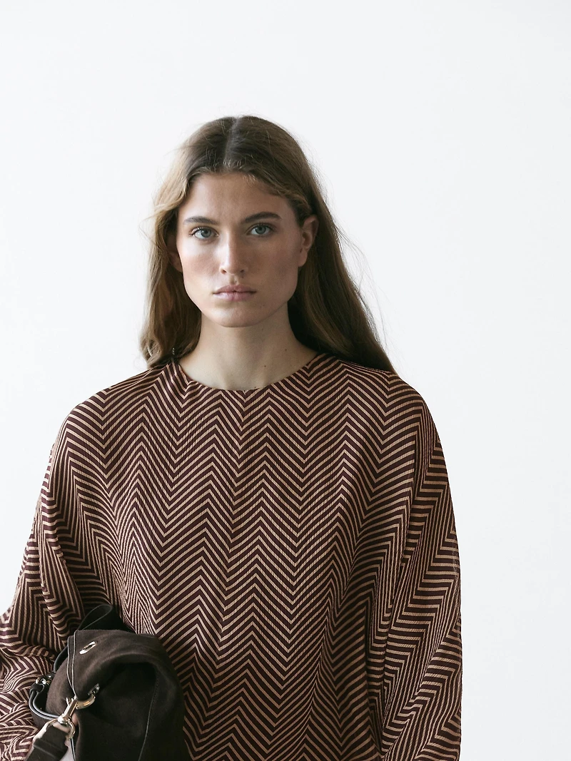 Flowing geometric print blouse