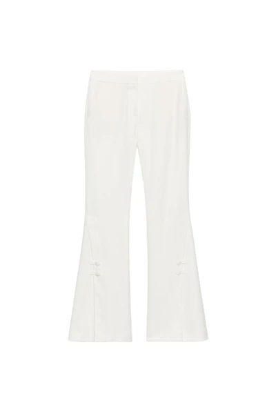 PANTALON À OUVERTURES SUR LE BAS