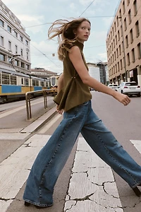 ASYMMETRIC KNIT TOP WITH SIDE APPLIQUÉS
