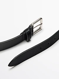 Leather belt with metallic buckle