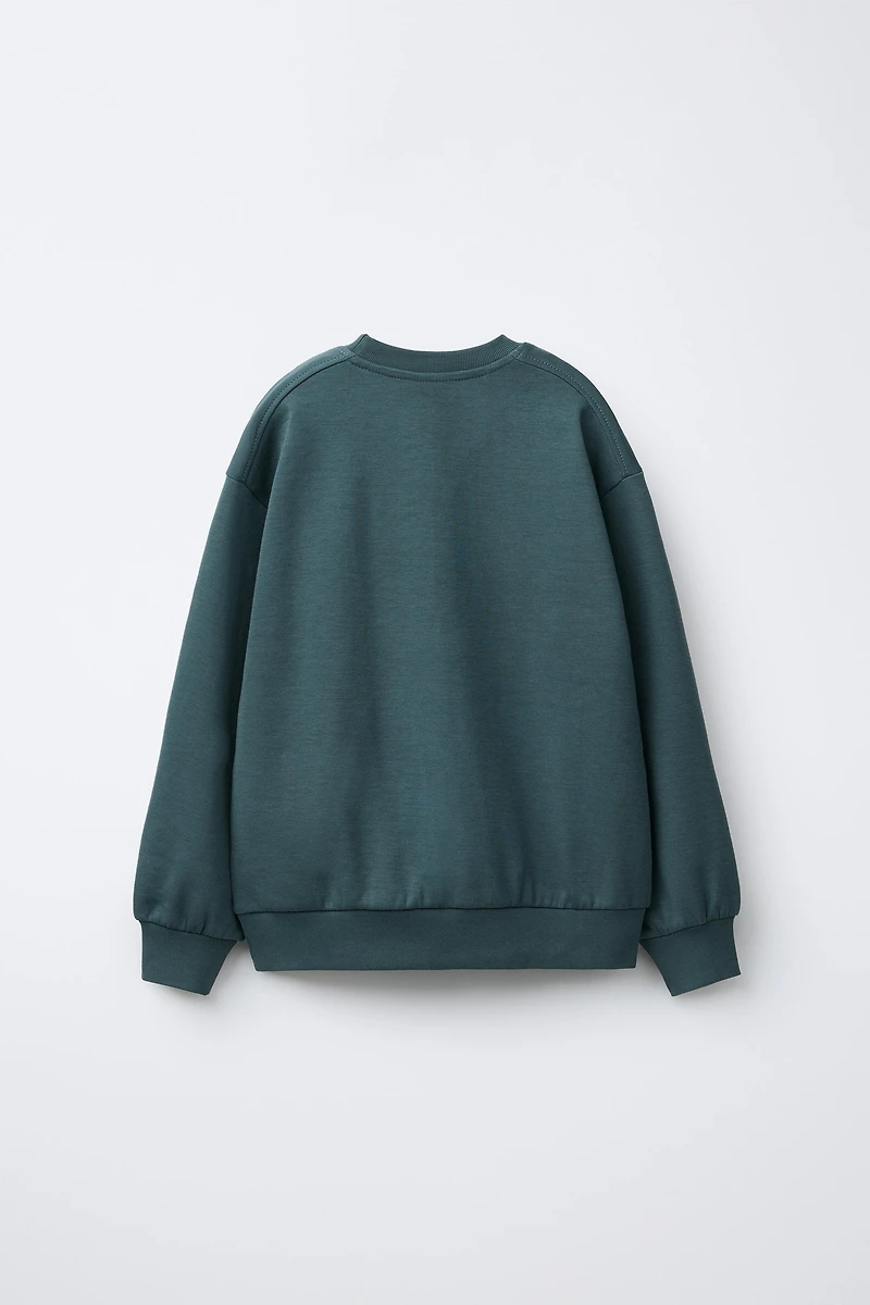 ENSEMBLE INTERLOCK SWEAT ET JOGGER INSCRIPTION EN RELIEF