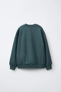 ENSEMBLE INTERLOCK SWEAT ET JOGGER INSCRIPTION EN RELIEF