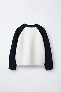 CONTRAST SLEEVE TEXT SWEATER