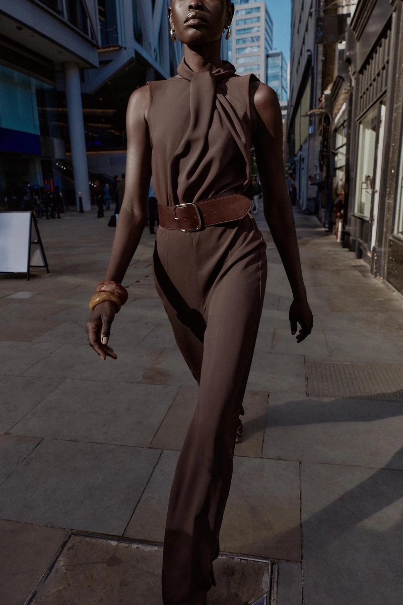 SLEEVELESS BELTED JUMPSUIT