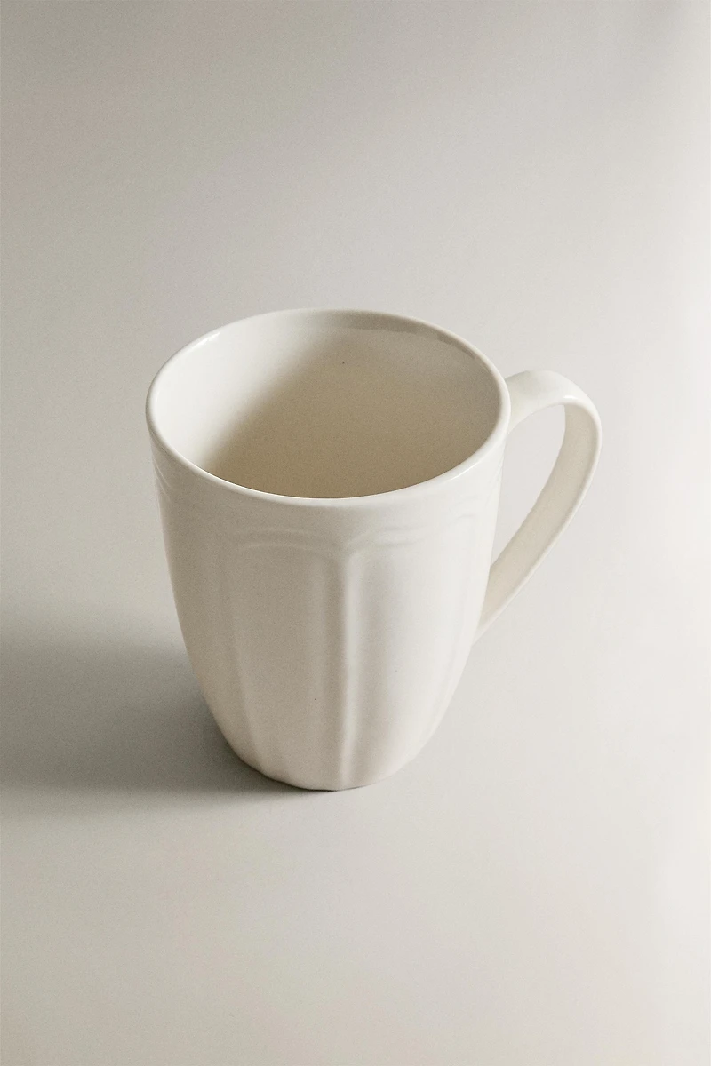 PORCELAIN MUG WITH RAISED DESIGN