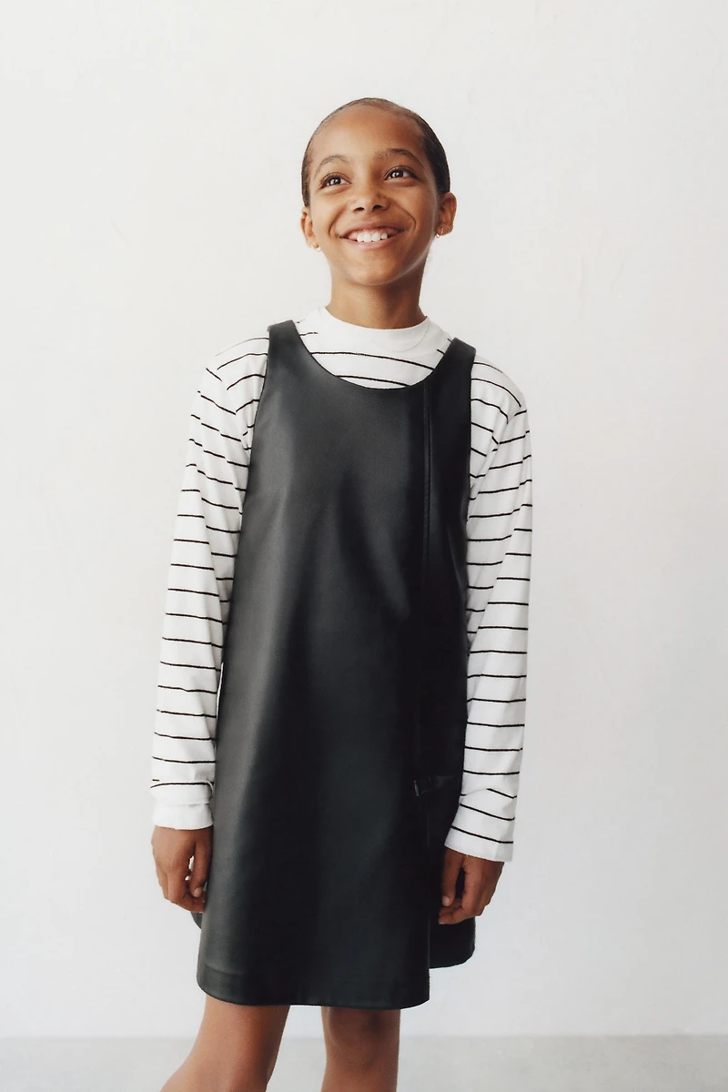 FAUX LEATHER BOW PINAFORE DRESS