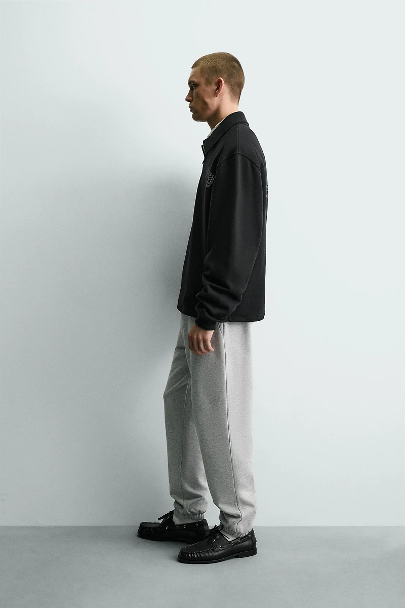 SWEAT COL ZIPPÉ INSCRIPTIONS