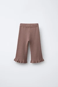 PANTALON EN MAILLE AVEC VOLANTS