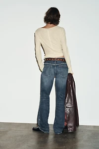 TRF SLUNG LOW-RISE STUDDED JEANS