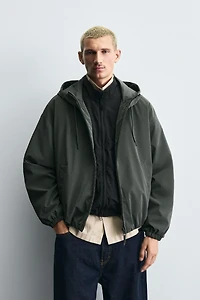 VESTE TECHNIQUE À CAPUCHE