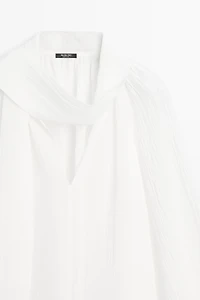 Flowing V-neck blouse with tie