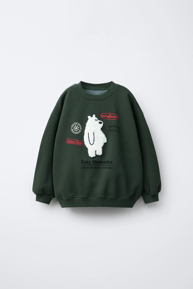 FAUX SHEARLING BEAR PATCH SWEATSHIRT