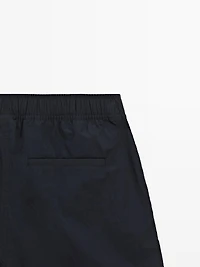 Plain swimming trunks with waist detail