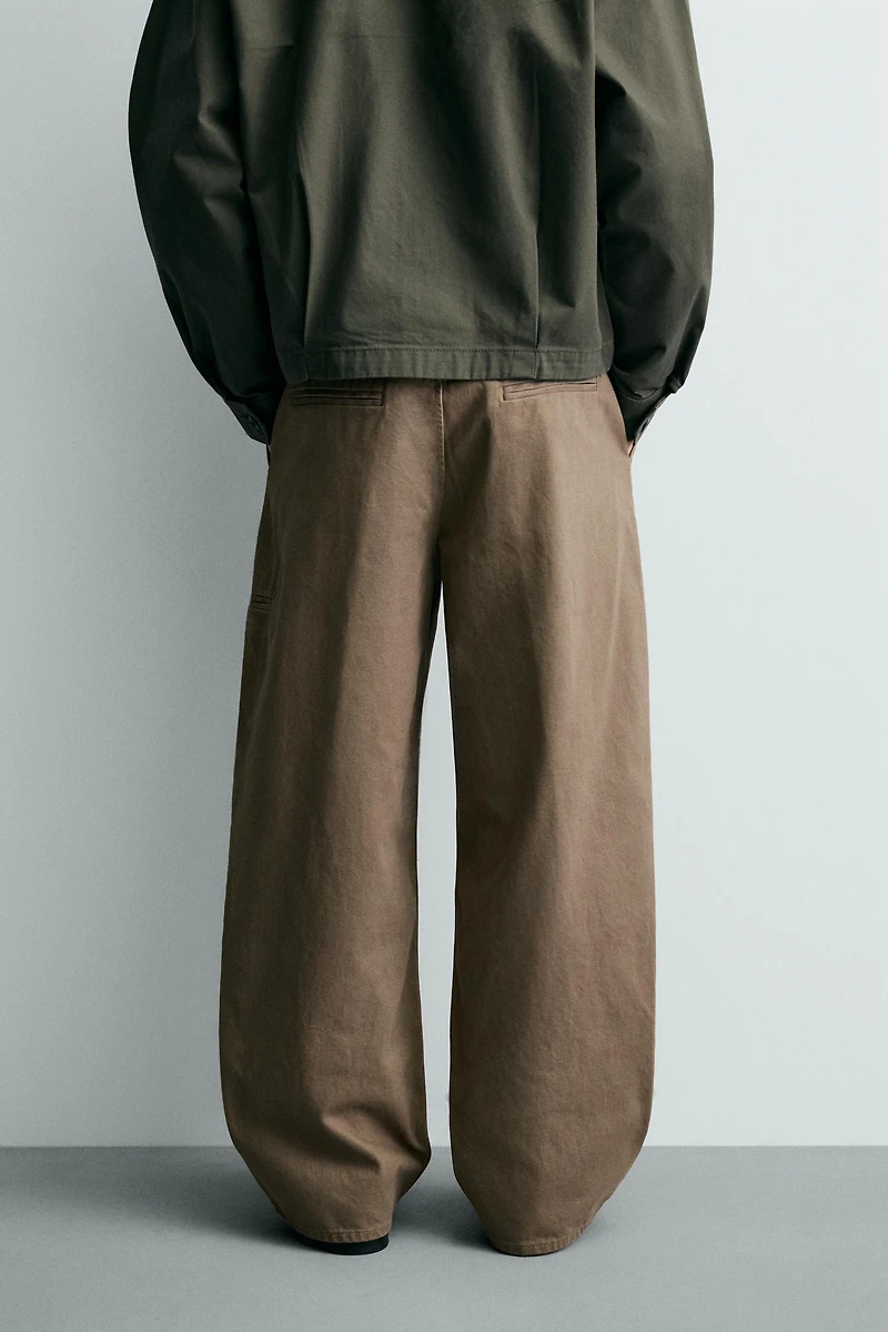 PLEATED BAGGY FIT CHINO PANTS