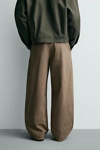 PLEATED BAGGY FIT CHINO PANTS
