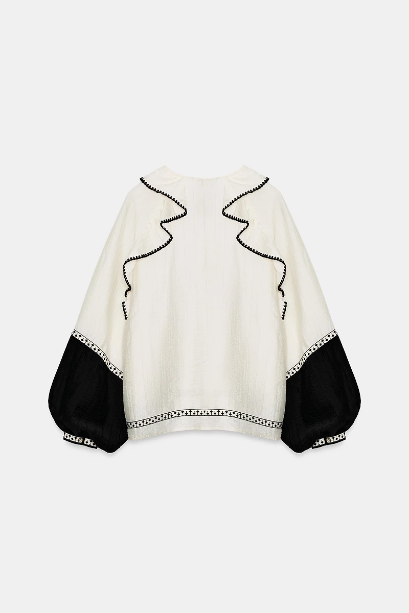 VOLUMINOUS RUFFLE BLOUSE