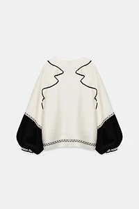 VOLUMINOUS RUFFLE BLOUSE