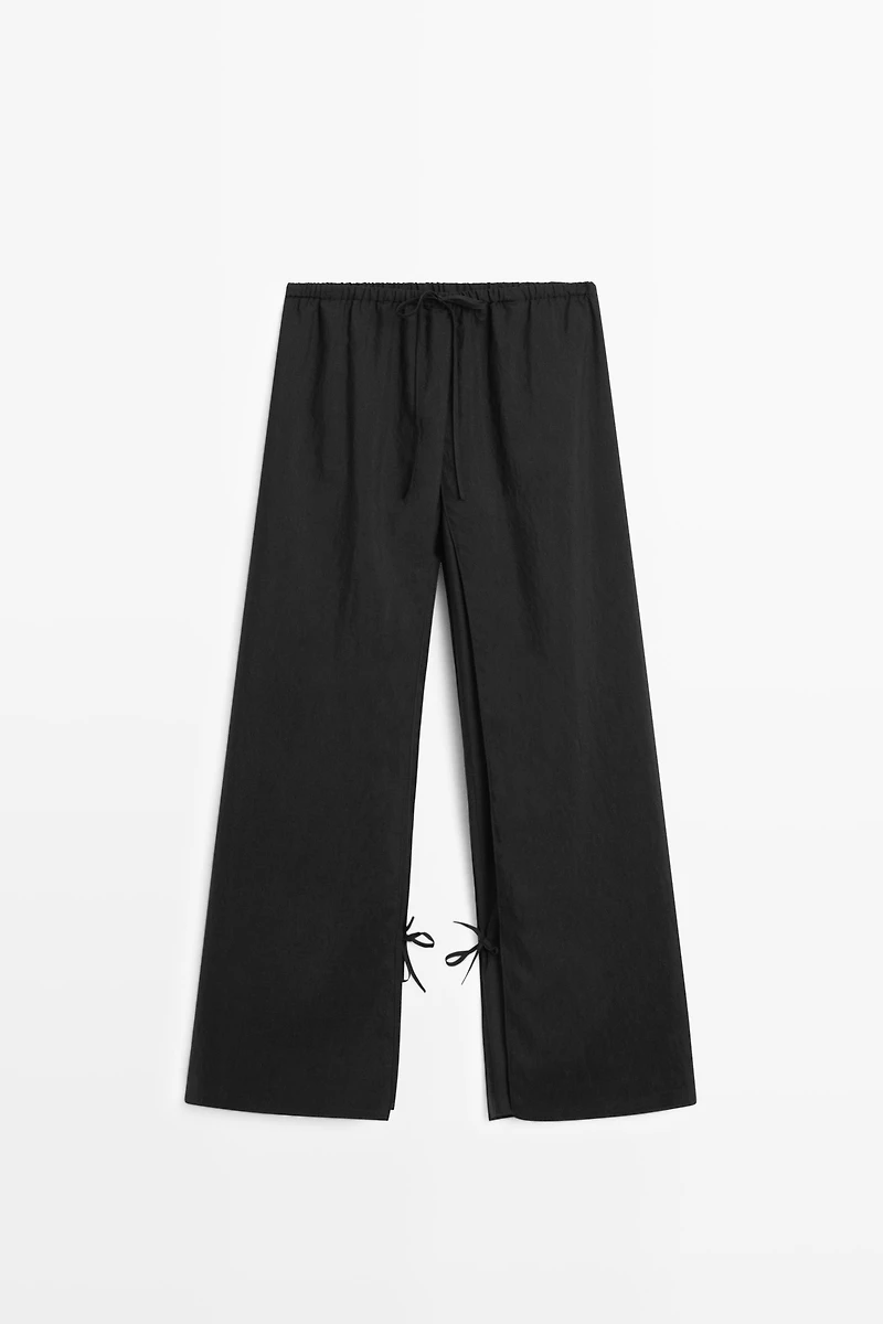 Pantalon superposé avec nœuds