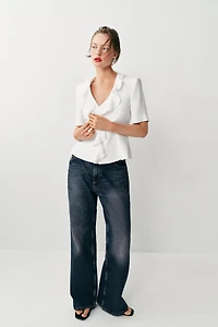 VESTE À MANCHES COURTES ET VOLANTS