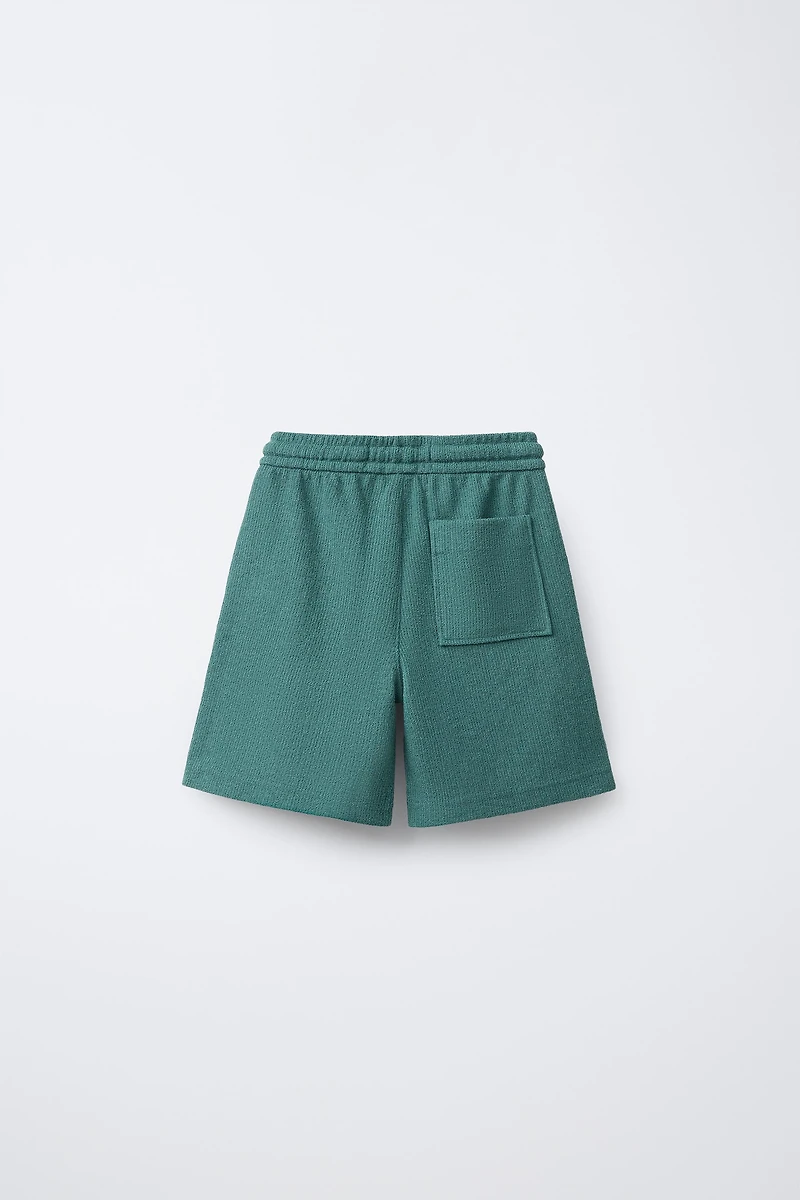 SLIM FIT TEXTURED TOWELING SHORTS