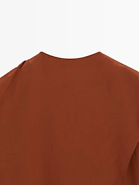 Flowing blouse with tied neck