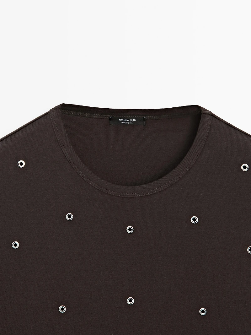 Oversized T-shirt with eyelets