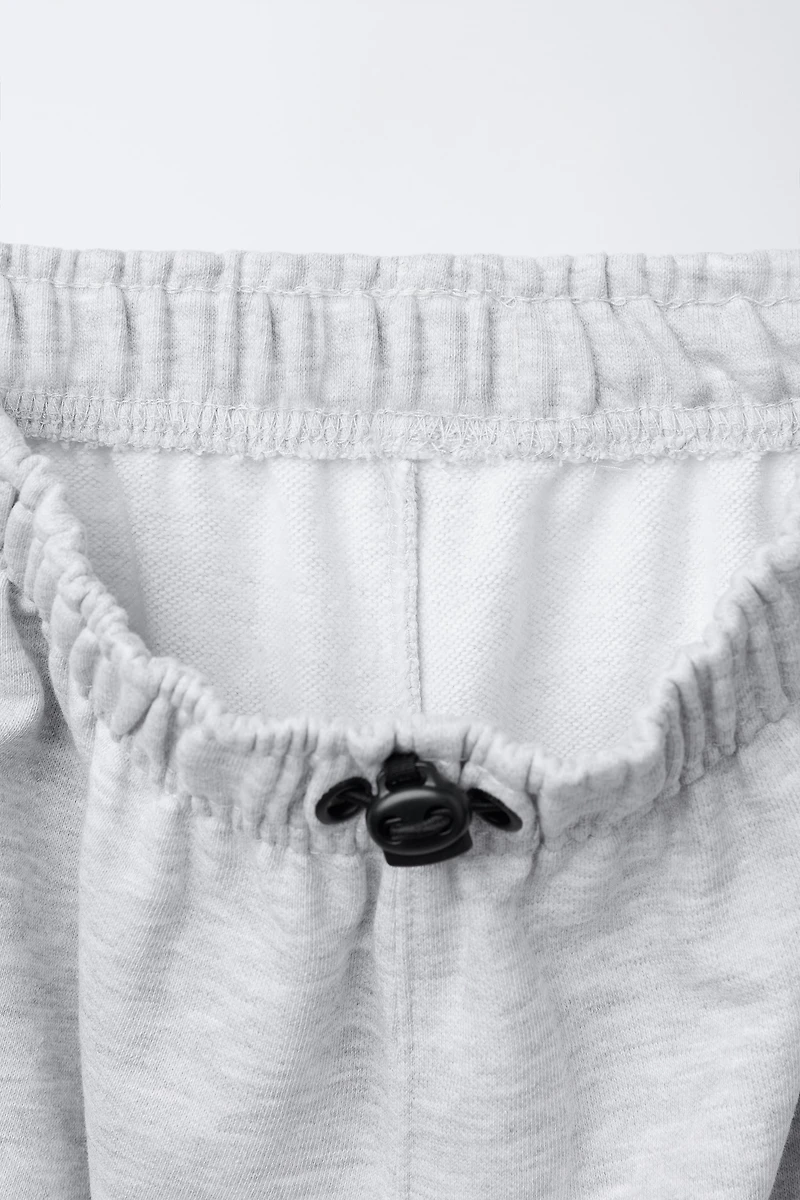 PANTALON DE JOGGING EN MOLLETON STOPPEURS