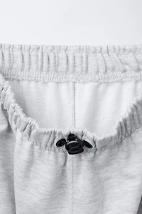 PANTALON DE JOGGING EN MOLLETON STOPPEURS