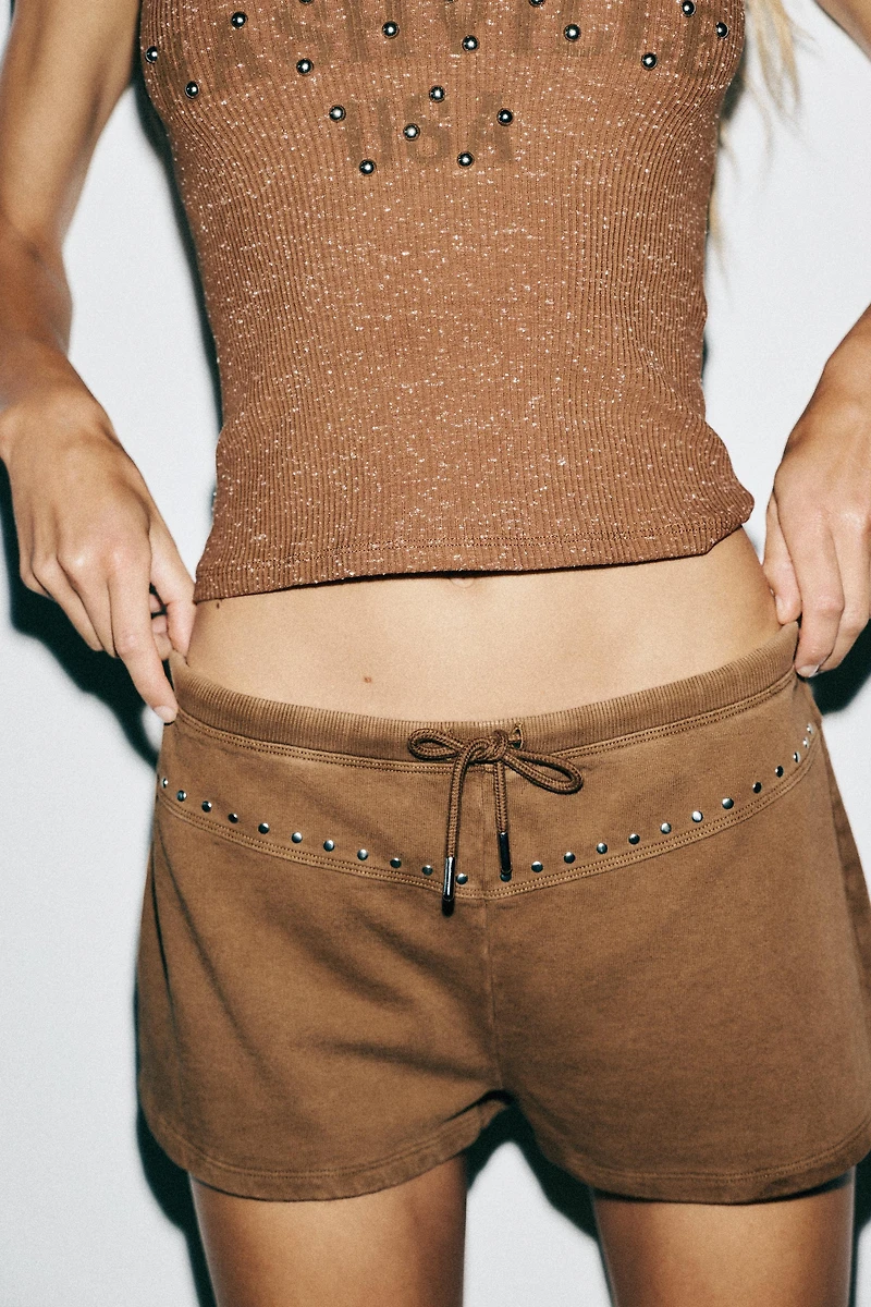 WASHED EFFECT STUDDED SHORTS