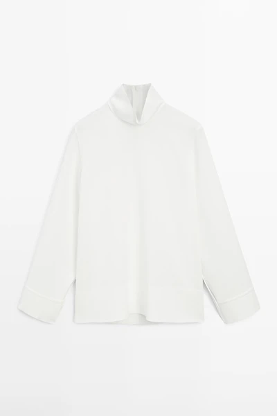 High neck blouse with hem detail