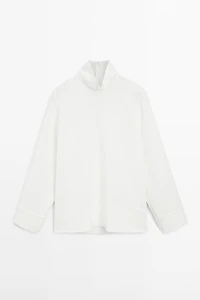 High neck blouse with hem detail