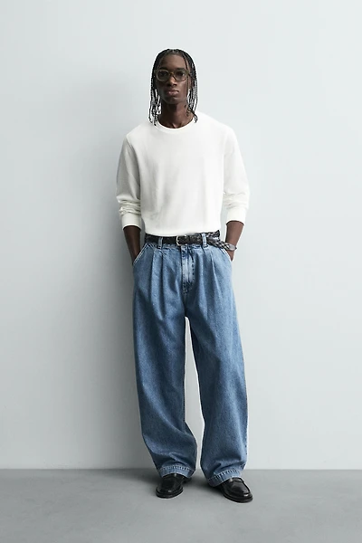 JEAN COUPE AMPLE À PLIS
