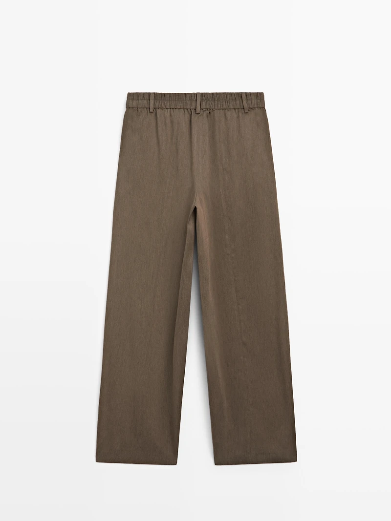 Flowing trousers with elasticated waistband