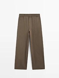 Flowing trousers with elasticated waistband